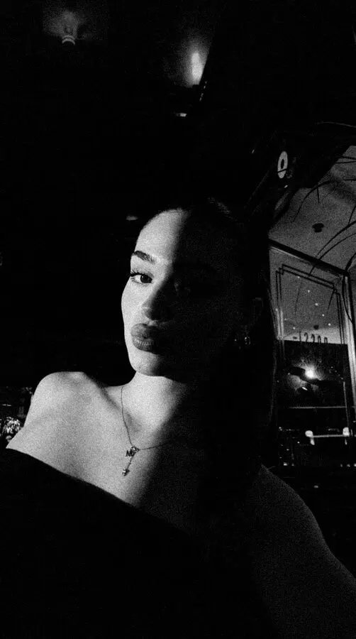 Film Noir look: the same selfie in black and white with one hard light and deep shadows